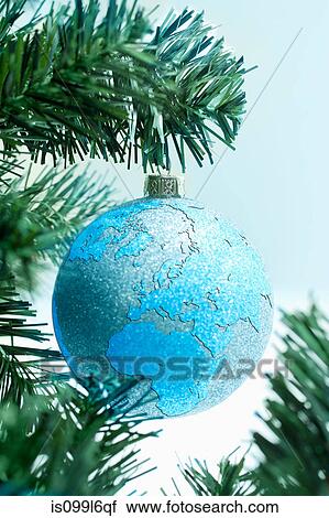 Globe bauble on christmas tree View Large Photo Image Stock Image - Globe bauble on christmas tree. Fotosearch