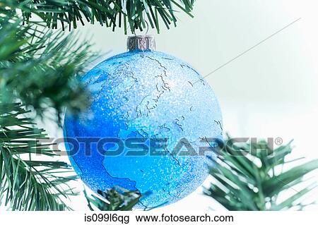 Globe bauble on christmas tree View Large Photo Image Stock Image - Globe bauble on christmas tree. Fotosearch