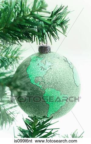 Green globe bauble on tree View Large Photo Image Stock Photograph - Green globe bauble on tree. Fotosearch