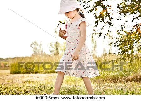 Little girl walking in park View Large Photo Image Picture - Little girl walking in park. Fotosearch