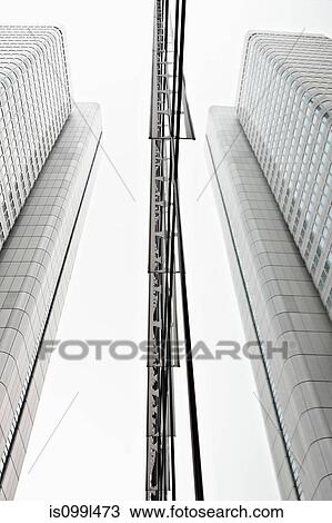 Low angle view of modern office buildings in business district View Large Photo Image Stock Image - Low angle view of modern office buildings in business district. Fotosearch