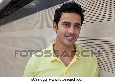 Man leaning against a wall View Large Photo Image Stock Photography - Man leaning against a wall. Fotosearch
