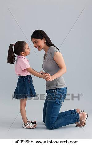 Stock Image - Mother and daughter having fun. Fotosearch