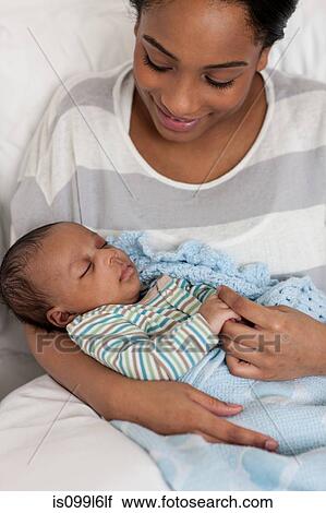 Mother holding baby boy View Large Photo Image Stock Image - Mother holding baby boy. Fotosearch