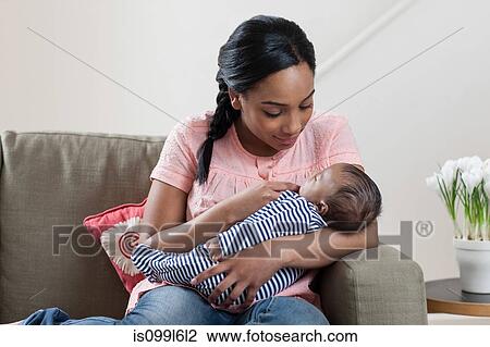 Mother holding baby son View Large Photo Image Stock Image - Mother holding baby son. Fotosearch