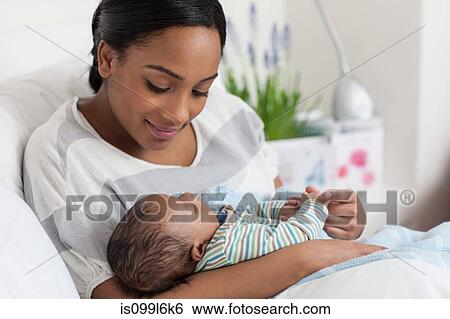 New mother and baby boy View Large Photo Image Stock Photograph - New mother and baby boy. Fotosearch