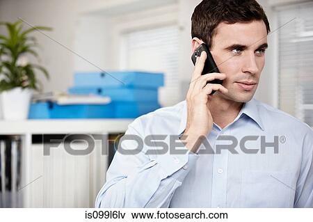 Office worker on cellphone View Large Photo Image Stock Photo - Office worker on cellphone. Fotosearch