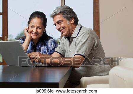 Old couple with a laptop View Large Photo Image Stock Image - Old couple with a laptop. Fotosearch