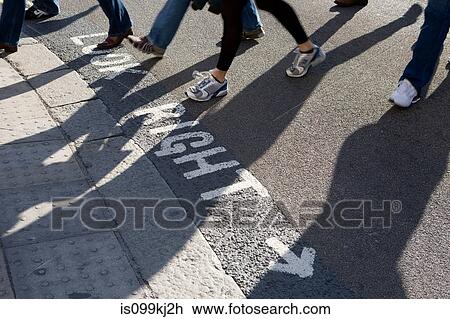 Stock Image - Pedestrians crossing a road. Fotosearch