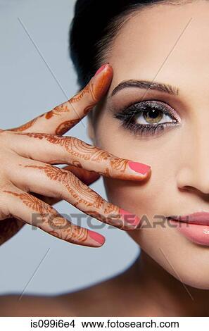 Portrait of a beautiful woman with mehndi View Large Photo Image Picture - Portrait of a beautiful woman with mehndi. Fotosearch