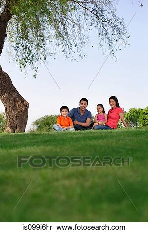 Stock Photography - Portrait of a family in a park. Fotosearch