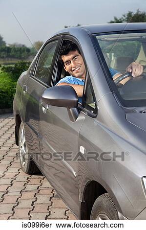 Portrait of a man in his car View Large Photo Image Stock Photography - Portrait of a man in his car. Fotosearch