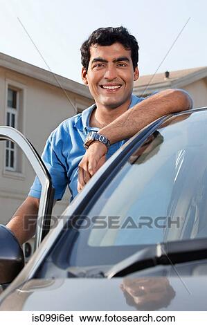 Portrait of a man next to his car View Large Photo Image Stock Photograph - Portrait of a man next to his car. Fotosearch
