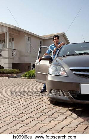 Portrait of a man next to his car View Large Photo Image Stock Photograph - Portrait of a man next to his car. Fotosearch