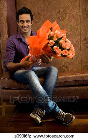 Portrait of a man with a bouquet of flowers View Large Photo Image Stock Photo - Portrait of a man with a bouquet of flowers. Fotosearch
