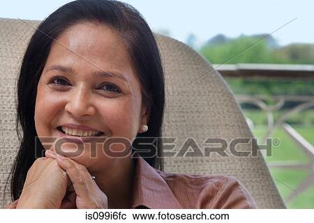 Stock Image - Portrait of a mature woman smiling. Fotosearch