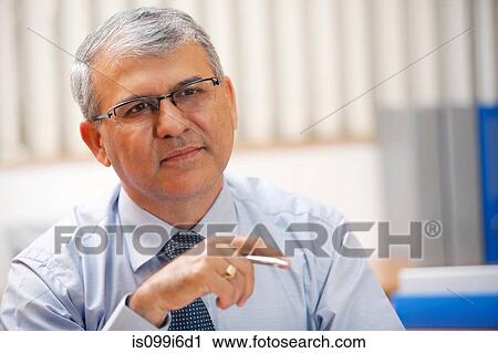 Stock Image - Portrait of a senior businessman. Fotosearch