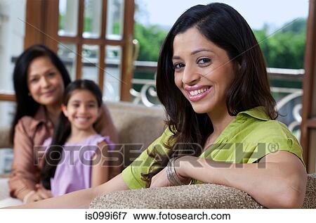 Portrait of a woman on a sofa View Large Photo Image Stock Photo - Portrait of a woman on a sofa. Fotosearch
