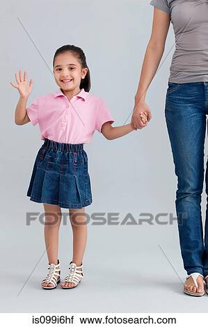 Portrait of a young girl waving View Large Photo Image Stock Image - Portrait of a young girl waving. Fotosearch