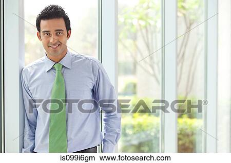 Portrait of an executive smiling View Large Photo Image Picture - Portrait of an executive smiling. Fotosearch