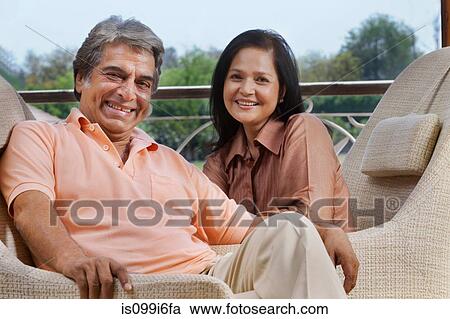 Stock Image - Portrait of mature couple smiling. Fotosearch