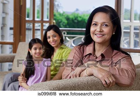 Stock Photo - Portrait of old woman on a sofa. Fotosearch