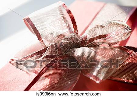 Picture - Red gift with ribbon bow. Fotosearch