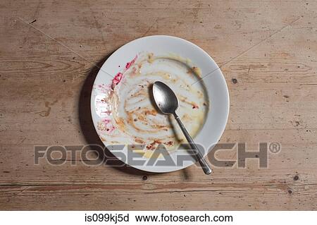 Remains of eaten pudding on plate View Large Photo Image Stock Image - Remains of eaten pudding on plate. Fotosearch