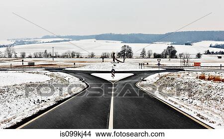 Picture - Road and roundabout in snow. Fotosearch