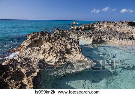 Rocks and Caribbean Sea, Grand Cayman, Cayman Islands View Large Photo Image Stock Image - Rocks and Caribbean Sea, Grand Cayman, Cayman Islands. Fotosearch