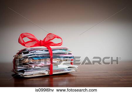 Stock Photo - Stack of letters tied together with ribbon. Fotosearch