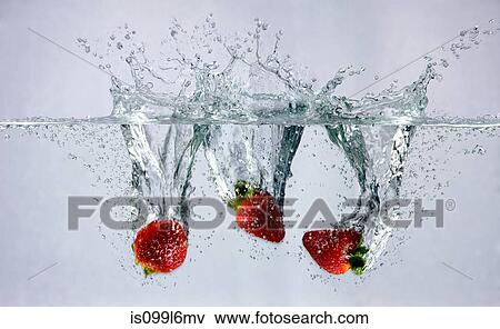 Strawberries falling into water View Large Photo Image Stock Photo - Strawberries falling into water. Fotosearch
