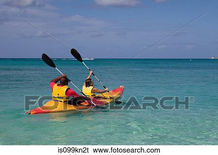 Two people kayaking in Caribbean sea, Grand Cayman, Cayman Islands View Large Photo Image Stock Photograph - Two people kayaking in Caribbean sea, Grand Cayman, Cayman Islands. Fotosearch