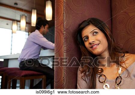 Woman in a restaurant smiling View Large Photo Image Stock Image - Woman in a restaurant smiling. Fotosearch
