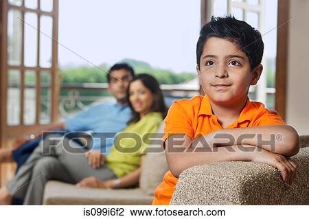Young boy on a sofa View Large Photo Image Stock Image - Young boy on a sofa. Fotosearch