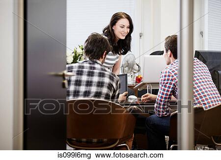 Young colleagues in office View Large Photo Image Stock Image - Young colleagues in office. Fotosearch