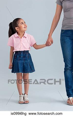 Young girl holding her mothers hand View Large Photo Image Stock Image - Young girl holding her mothers hand. Fotosearch