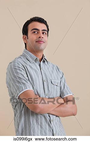 Young man posing View Large Photo Image Stock Photo - Young man posing. Fotosearch