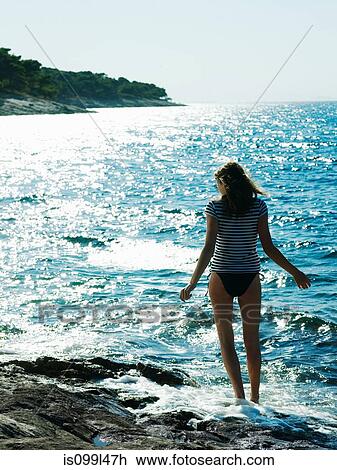 Young woman walking in sea, Dubrovnik, Croatia View Large Photo Image Stock Image - Young woman walking in sea, Dubrovnik, Croatia. Fotosearch