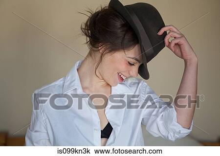 Young woman with fedora View Large Photo Image Stock Image - Young woman with fedora. Fotosearch