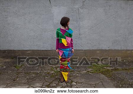 Young woman wrapped in bunting View Large Photo Image Stock Photo - Young woman wrapped in bunting. Fotosearch