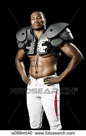 American football player wearing shoulder padding View Large Photo Image Stock Image - American football player wearing shoulder padding. Fotosearch