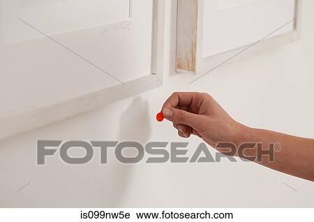 Art dealer placing sold dots under artwork in gallery View Large Photo Image Stock Image - Art dealer placing sold dots under artwork in gallery. Fotosearch