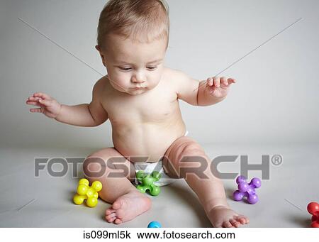 Baby boy playing with jacks View Large Photo Image Stock Image - Baby boy playing with jacks. Fotosearch