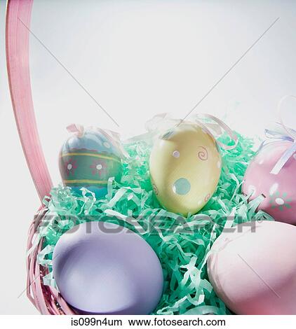 Picture - Basket of easter eggs, studio shot. Fotosearch