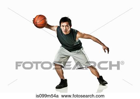 Basketball player holding ball View Large Photo Image Stock Image - Basketball player holding ball. Fotosearch