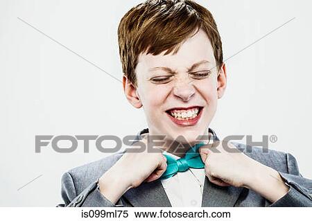 Boy adjusting bow tie View Large Photo Image Stock Photography - Boy adjusting bow tie. Fotosearch