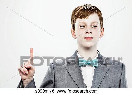 Boy pointing upwards with index finger View Large Photo Image Stock Photograph - Boy pointing upwards with index finger. Fotosearch