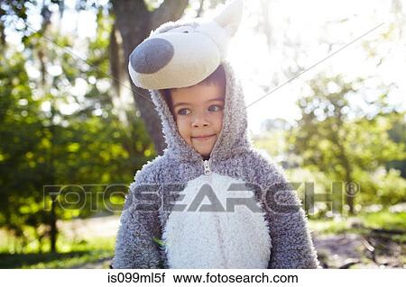Stock Image - Boy wearing a wolf costume. Fotosearch