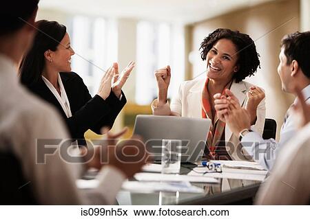Business colleagues applauding in office View Large Photo Image Stock Photo - Business colleagues applauding in office. Fotosearch
